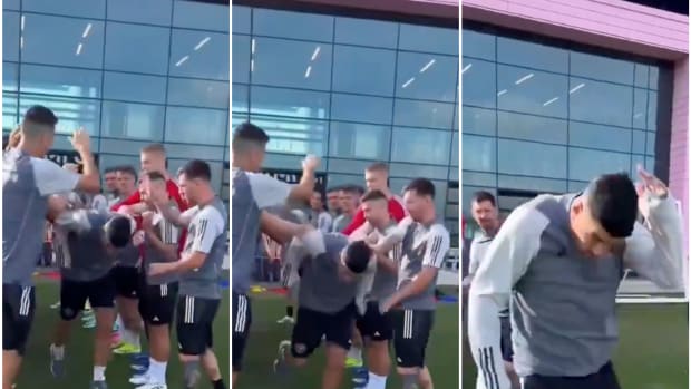 Lionel Messi pictured playfully slapping Luis Suarez during an Inter Miami training session in January 2024